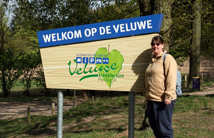 Amy at Welcome to the Veluwe sign